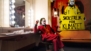 The Joker Joaquin Phoenix finds inspiration in street art of yellow raincoat of Greta